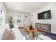 Comfortable living room features a white couch, TV, and stylish decor at 4166 N Yates St, Denver, CO 80212