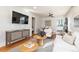 Bright living room with modern furnishings, hardwood floors, and a view into the kitchen at 4166 N Yates St, Denver, CO 80212