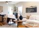 Bright living room featuring hardwood floors, natural light, and comfortable seating at 4166 N Yates St, Denver, CO 80212
