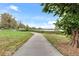 Scenic walking path next to a beautiful lake and lush greenery on a bright, sunny day at 4166 N Yates St, Denver, CO 80212