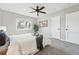 Comfortable bedroom boasts natural light, plush carpeting, and ample closet space, offering a serene retreat at 1047 Scranton St, Aurora, CO 80011