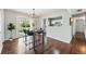 Stylish dining room featuring modern lighting, wood floors, and sliding glass doors at 1047 Scranton St, Aurora, CO 80011