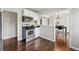 Clean kitchen with stainless steel appliances and view to dining area at 1047 Scranton St, Aurora, CO 80011