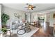 Inviting living room featuring modern decor, stylish furniture, and hardwood flooring throughout at 1047 Scranton St, Aurora, CO 80011