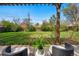 Relaxing patio space with comfortable seating overlooking a spacious yard at 1047 Scranton St, Aurora, CO 80011