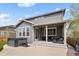 Backyard view of siding, porch, hot tub, and privacy fence at 6827 Leilani Ln, Castle Rock, CO 80108
