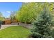 Landscaped yard with a fire pit and green grass at 6827 Leilani Ln, Castle Rock, CO 80108