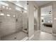 Elegant bathroom featuring a glass shower and adjacent bedroom at 6827 Leilani Ln, Castle Rock, CO 80108