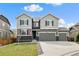 Charming two-story home with a three-car garage and well-maintained lawn at 6827 Leilani Ln, Castle Rock, CO 80108