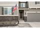 Close up on Front Entrance featuring stone detail and American flag at 6827 Leilani Ln, Castle Rock, CO 80108