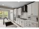 Beautiful kitchen featuring white cabinets, sleek countertops, stainless appliances, and a gas cooktop at 6827 Leilani Ln, Castle Rock, CO 80108