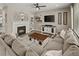 Cozy living room with fireplace and open layout, ideal for entertaining at 6827 Leilani Ln, Castle Rock, CO 80108