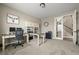A cozy home office with built-in shelves and ample natural light at 6827 Leilani Ln, Castle Rock, CO 80108