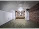 Spacious basement featuring exposed brick wall, carpet and bright ceiling at 814 Rose St, Georgetown, CO 80444