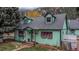 Charming turquoise and pink home with mature trees and mountain views at 814 Rose St, Georgetown, CO 80444