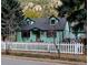 Charming home with a well-maintained yard and white picket fence at 814 Rose St, Georgetown, CO 80444
