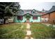 Charming home with a well-maintained yard and stone walkway at 814 Rose St, Georgetown, CO 80444