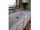 Close-up of kitchen sink with a modern faucet and white countertops at 814 Rose St, Georgetown, CO 80444