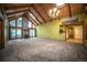Spacious living room with beamed ceilings, skylights, and a stone fireplace at 814 Rose St, Georgetown, CO 80444