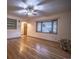 Inviting living room with hardwood floors, bay window, and a ceiling fan at 814 Rose St, Georgetown, CO 80444