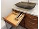 This bathroom features a sink with a cabinet with a drawer, marble countertop, and modern fixtures at 992 S Dearborn Way # 7, Aurora, CO 80012