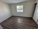 Bedroom features wood-look floors, neutral paint and ample natural light at 992 S Dearborn Way # 7, Aurora, CO 80012