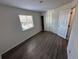 Bedroom features wood-look floors, neutral paint and closet at 992 S Dearborn Way # 7, Aurora, CO 80012