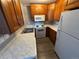 Updated kitchen features white appliances and stone countertops at 992 S Dearborn Way # 7, Aurora, CO 80012