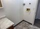 This is a bright laundry room with a marble countertop, fresh paint, and updated flooring at 992 S Dearborn Way # 7, Aurora, CO 80012
