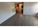 Open floor plan with window, and vinyl floors flowing into the kitchen at 992 S Dearborn Way # 7, Aurora, CO 80012