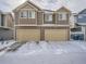 Two-story townhome with attached two-car garage at 17991 E 103Rd Ave, Commerce City, CO 80022