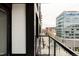 Modern balcony with black trim overlooking the city at 1750 Wewatta St # 740, Denver, CO 80202