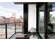 City balcony offering great city views, modern black railings and furniture at 1750 Wewatta St # 740, Denver, CO 80202
