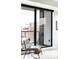 Cozy balcony with views of the cityscape, comfortable seating, and large sliding glass doors at 1750 Wewatta St # 740, Denver, CO 80202