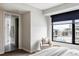 Bright bedroom features large window with city views and ensuite bathroom at 1750 Wewatta St # 740, Denver, CO 80202