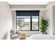 Comfortable bedroom with a large window offering city views at 1750 Wewatta St # 740, Denver, CO 80202
