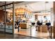 Modern coffee shop with wood accents, offering residents and guests a stylish place to relax and socialize at 1750 Wewatta St # 740, Denver, CO 80202
