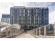 Modern high-rise apartment building with sleek blue accents, offering residents stylish urban living at 1750 Wewatta St # 740, Denver, CO 80202