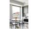 Bright eat-in kitchen includes stainless steel oven and a dining table with views of the city at 1750 Wewatta St # 740, Denver, CO 80202