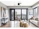 Cozy living area featuring large windows, contemporary decor, and comfortable seating at 1750 Wewatta St # 740, Denver, CO 80202
