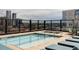 Rooftop pool with loungers and a beautiful city view at 1750 Wewatta St # 740, Denver, CO 80202