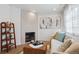 Inviting living room with stylish fireplace, modern decor, and lots of natural light at 15123 E Wesley Ave, Aurora, CO 80014