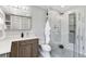 Stylish bathroom featuring a glass shower, updated vanity with storage, and modern fixtures for a luxurious feel at 2645 S Xanadu Way # D, Aurora, CO 80014