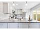 Bright kitchen with stainless steel appliances, spacious countertops and white cabinets at 2645 S Xanadu Way # D, Aurora, CO 80014