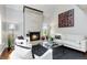 Comfortable living room featuring a fireplace, contemporary decor, and ample natural light for a welcoming ambiance at 2645 S Xanadu Way # D, Aurora, CO 80014