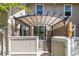 Charming patio area with a pergola and sliding glass door, offering a seamless transition to indoor living spaces at 2645 S Xanadu Way # D, Aurora, CO 80014