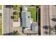 Aerial view of home highlighting the backyard lawn and patio areas with mature tree coverage at 7600 Kline Dr, Arvada, CO 80005