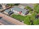 An aerial view of home showcasing the backyard lawn, patio, and privacy wall at 7600 Kline Dr, Arvada, CO 80005