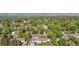 Aerial view showing the home surrounded by a lush landscape with mature trees throughout the neighborhood at 7600 Kline Dr, Arvada, CO 80005