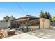 Outdoor patio features a hot tub, dining set, and rustic wooden decor, perfect for relaxing at 7600 Kline Dr, Arvada, CO 80005